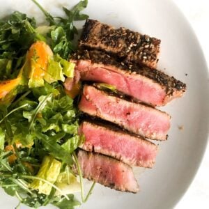 Ahi tuna salad on a white plate.