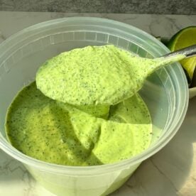 Cilantro lime cause in a spoon over a container.