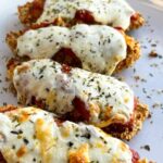 Air fryer chicken parmesan tenders on a white plate.