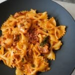 Creamy Sun Dried Tomato Pasta in a black bowl.