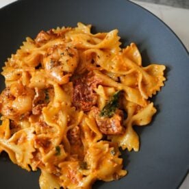 Creamy Sun Dried Tomato Pasta in a black bowl.
