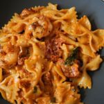 Creamy Sun Dried Tomato Pasta in a black bowl.