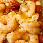 Baked Feta Pasta with shrimp, tomatoes, and basil in a creamy sauce.