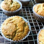 Close up of banana bread muffins on a wire rack.