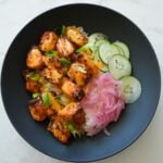 Crispy air-fried Bang Bang Salmon Bites drizzled with spicy-sweet bang bang sauce.
