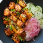 Crispy air-fried Bang Bang Salmon Bites drizzled with spicy-sweet bang bang sauce.