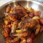 Buttermilk-brined Cornish hens roasted with rosemary, thyme, potatoes, and carrots.