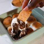 Air fryer s'mores dip with melted marshmallows and chocolate, served with graham crackers