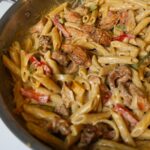 Creamy Rasta Pasta with jerk chicken and a trio of bell peppers.