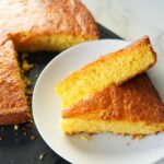 Moist and fluffy Jiffy cornbread topped with melted butter and honey, straight out of the oven.