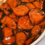 Southern candied yams with brown sugar, cinnamon, and butter, baked to golden perfection.