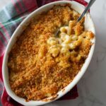 Garlic parmesan mac and cheese, topped with golden breadcrumbs, served in a small baking dish.