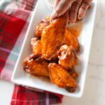 Crispy hot honey wings close up.