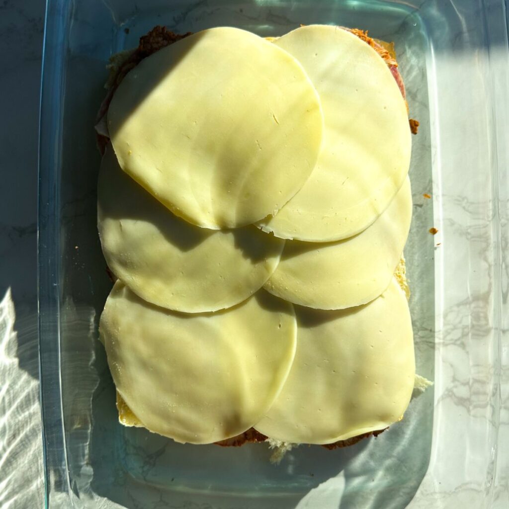 Provolone on top of grinder sandwich.