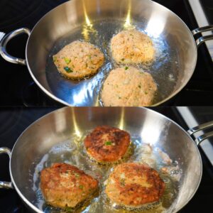 Salmon croquettes cooking in a skillet.