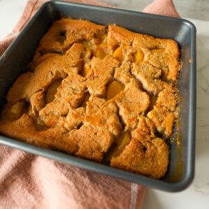 Peach cobbler in a pan.