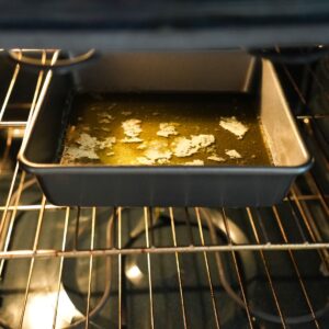 butter in a pan in oven