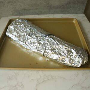 Ribs wrapped in foil.