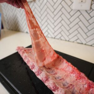 Membrane being lifted off ribs.