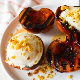 Grilled peaches with vanilla ice cream and walnuts.