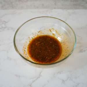 Lemon garlic chicken marinade in a bowl.