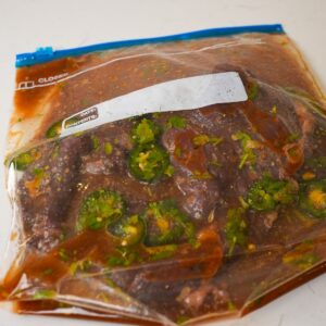 Steak marinating in a ziplock.