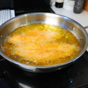 Catfish frying in hot oil.