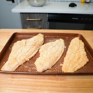 Catfish with breading before being fried.
