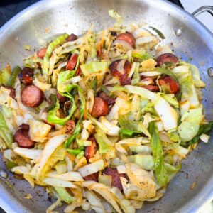 Cabbage in a pan with sausage.