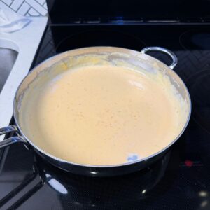 Cheese sauce in a pan.