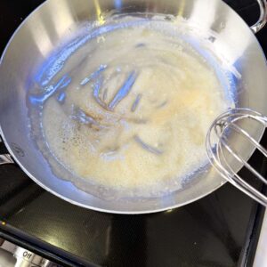 Butter and flour mixed together in a pan.