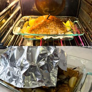 Roasted turkey breast in the oven and with foil on top.