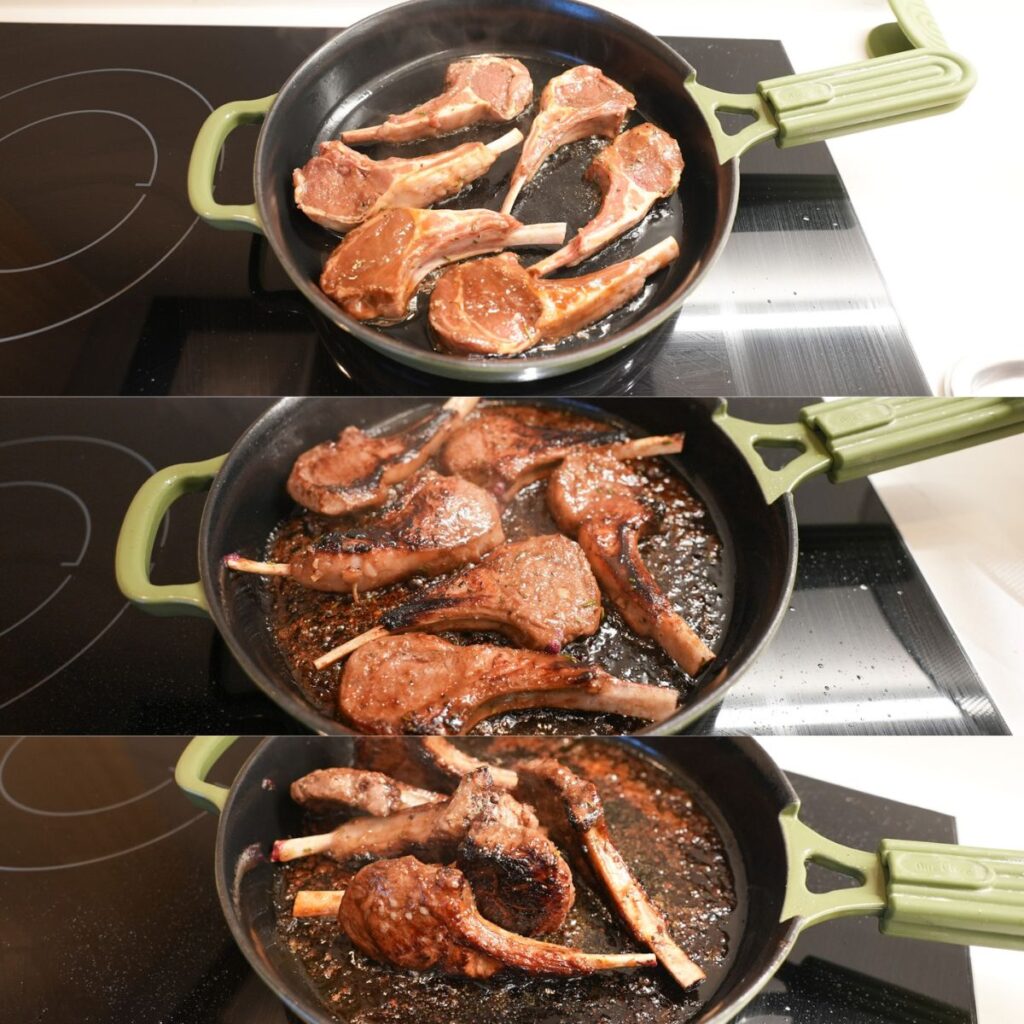Lamb chops frying in a cast iron skillet.