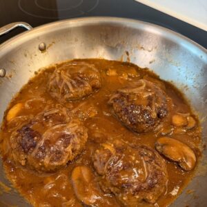 Salisbury steak patties in brown onion mushroom gravy.