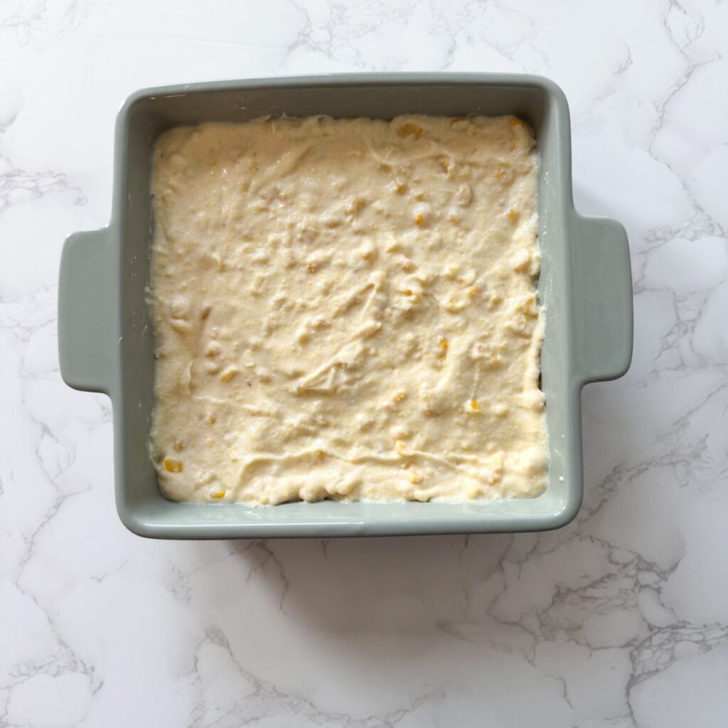 Corn casserole in a baking dish before baking.