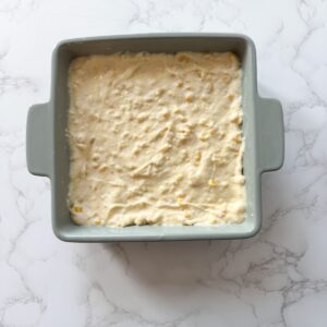 Corn casserole in a baking dish before baking.