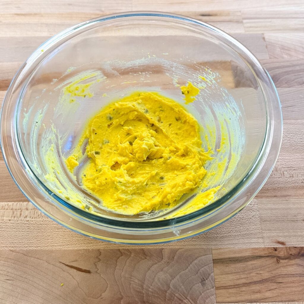 Filling for deviled eggs in a bowl.