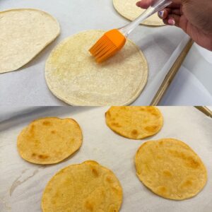 Corn tortillas being brushed with olive oil then shown crispy out of the oven.