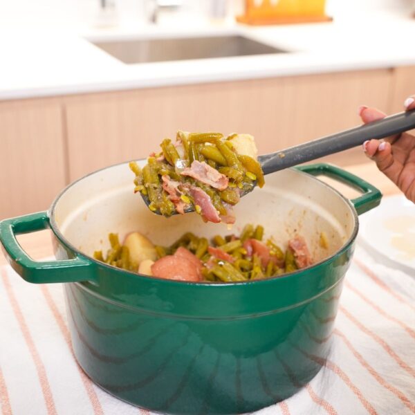 Southern green beans and red potatoes cooked with bacon in a pot with a light savory broth.