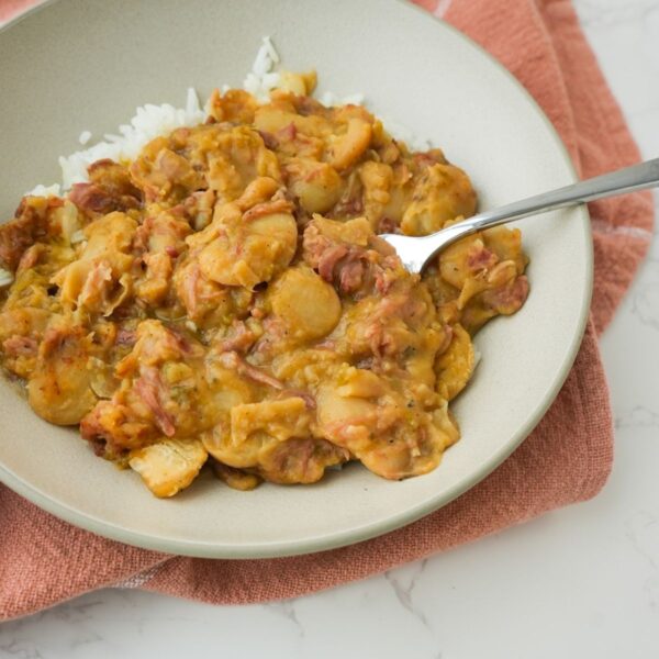 Southern Lima Beans in a bowl over white rice.