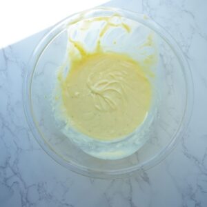 Filling for key lime pie in a bowl.