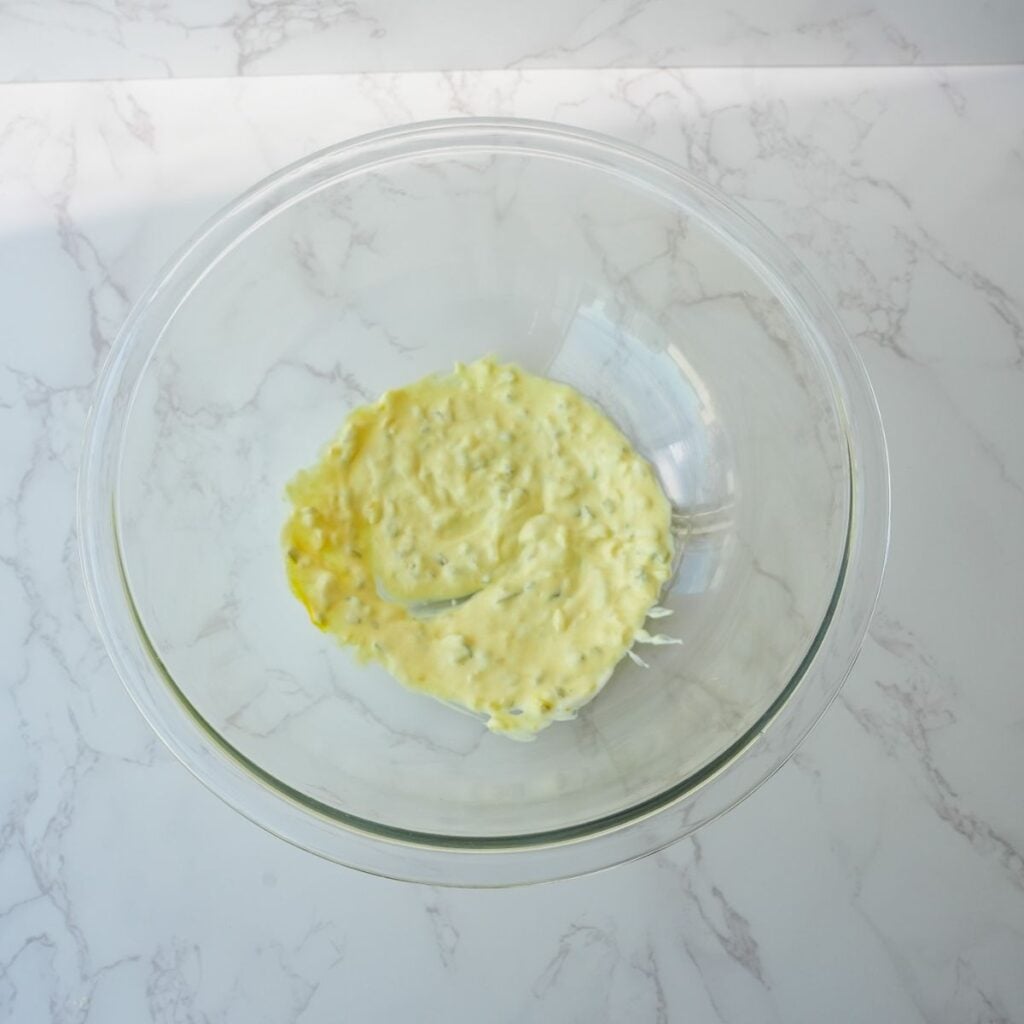 Mustard, mayo and relish mixed together in a bowl.