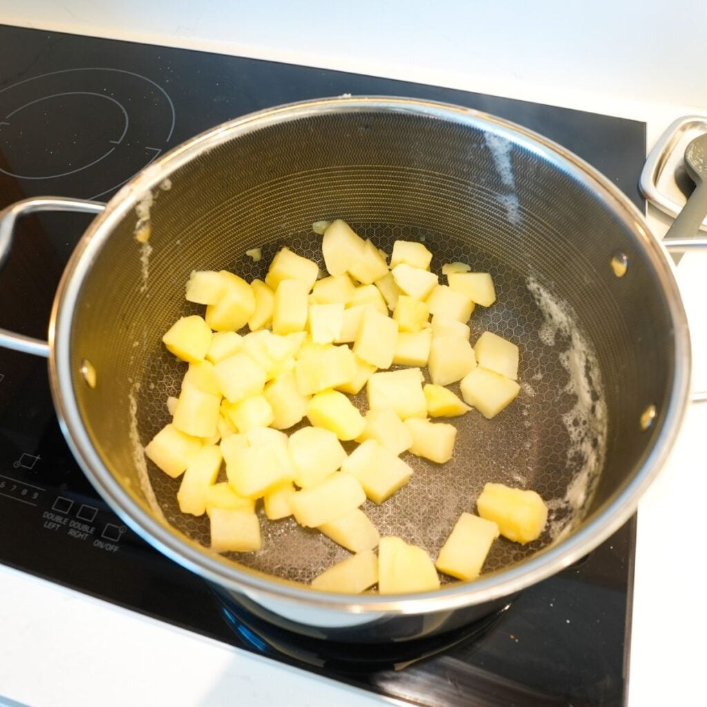 Potatoes cooked in a pot.
