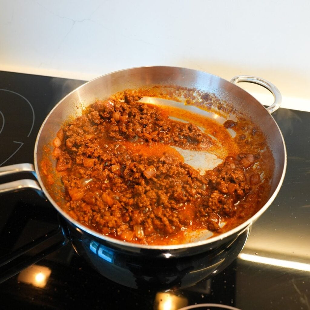 Hot dog chili in a skillet.