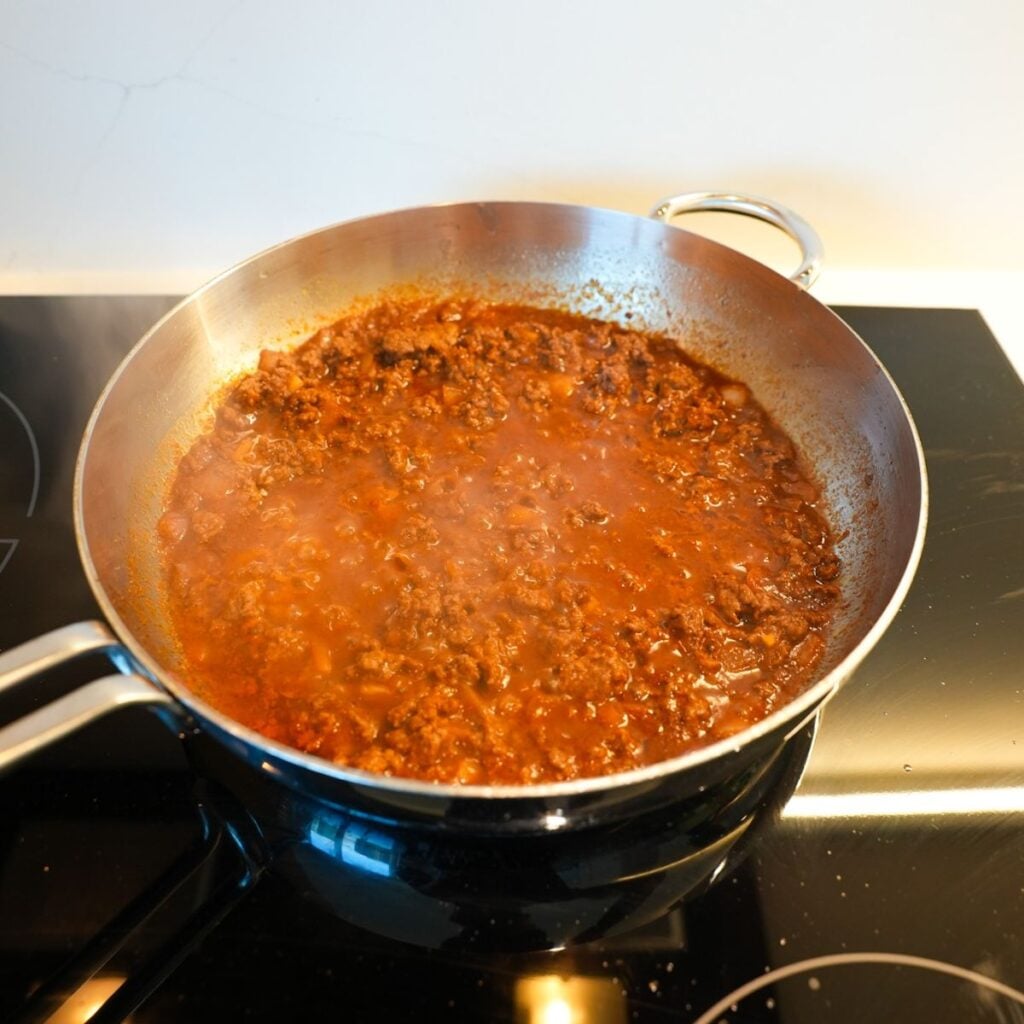 Chili simmering in skillet.