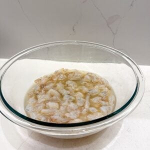 Shrimp in a bowl with lime juice.