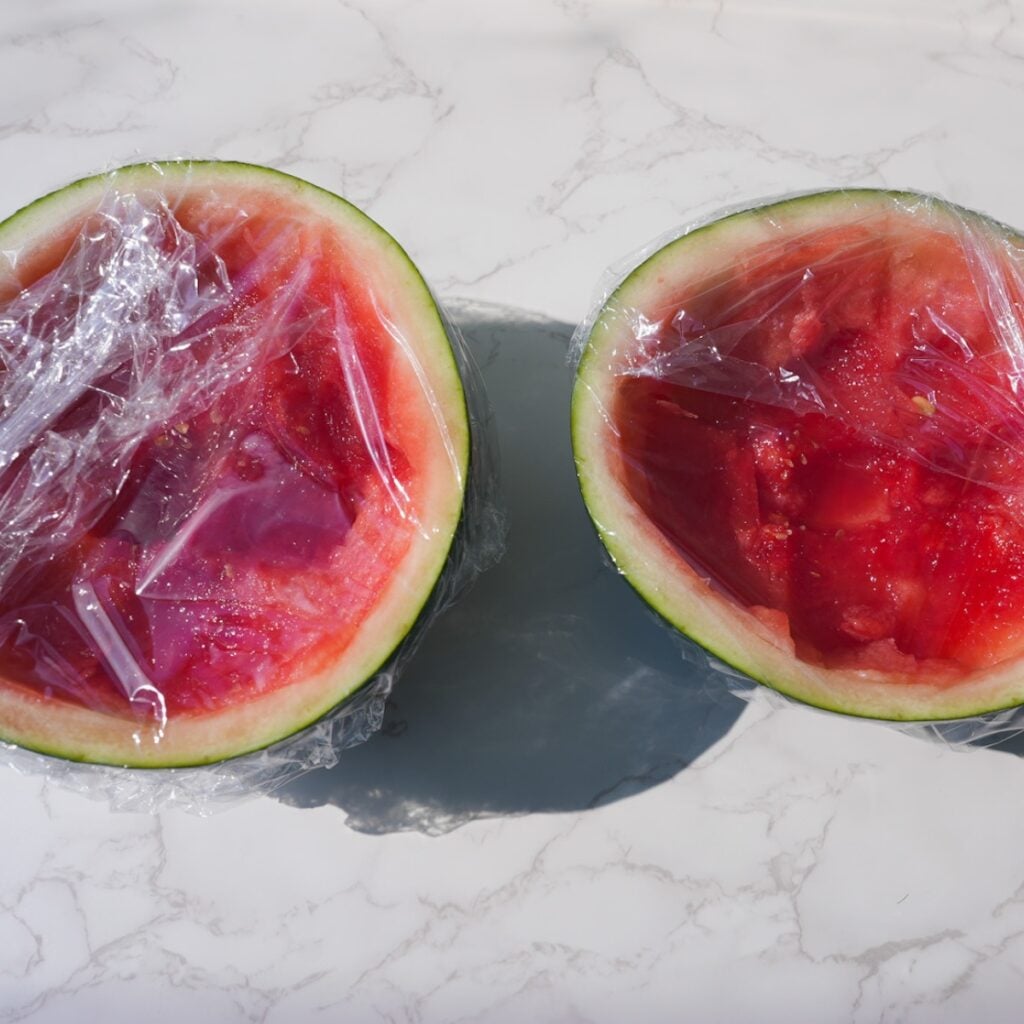 Watermelon cups wrapped with plastic wrap.