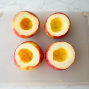 Apples with the tops cut off and hollowed out.