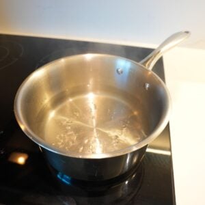 Water boiling in a small pot.