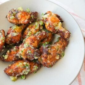 Crispy garlic parmesan wings coated with garlic butter, grated Parmesan, and chopped fresh parsley.